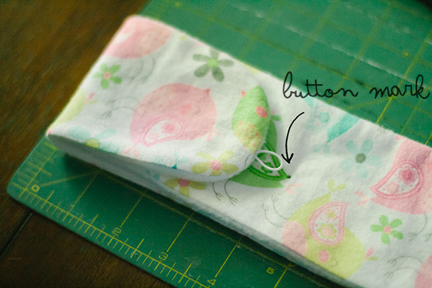 Button hole placement on tin whistle case