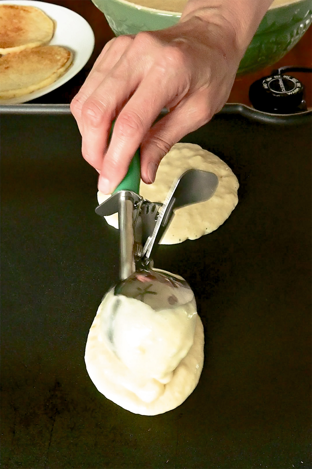 scooping pancake batter